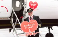 Cpt. Eddie Watt and Saab 340, both of which retired this week (Pic: Dylan Morrison/Loganair)